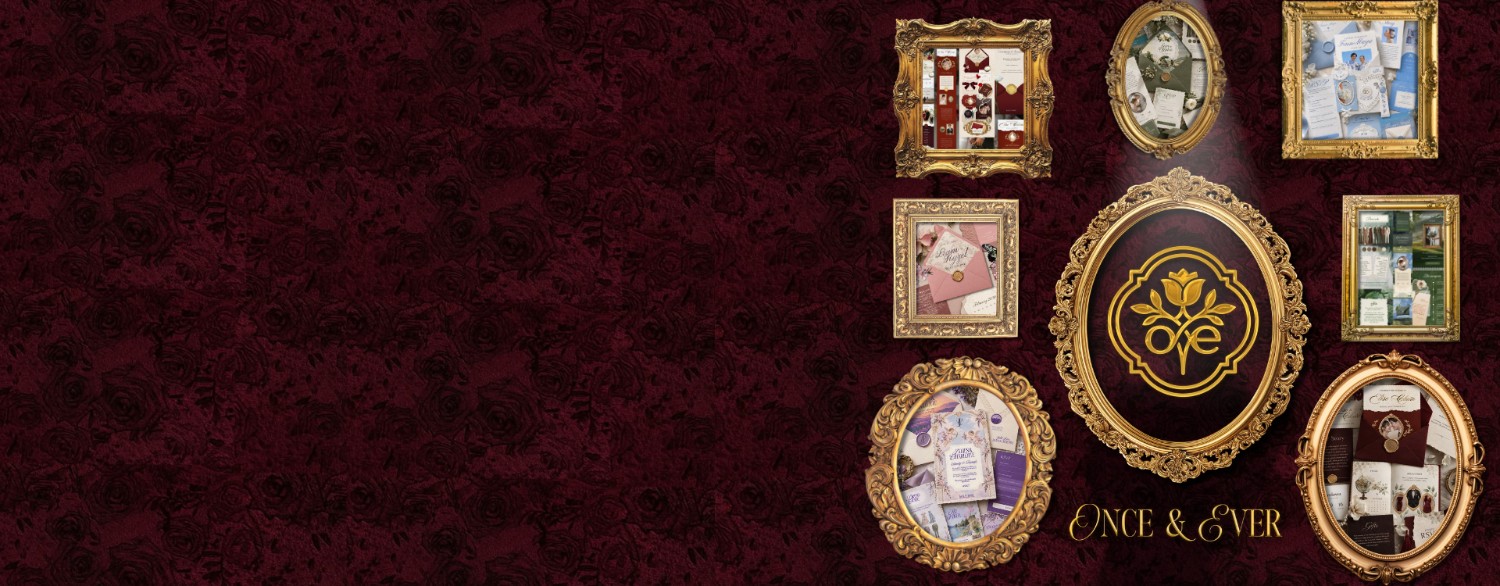 The Once & Ever collection hung as a gallery wall — each invitation suite in a gilded frame around the studio crest